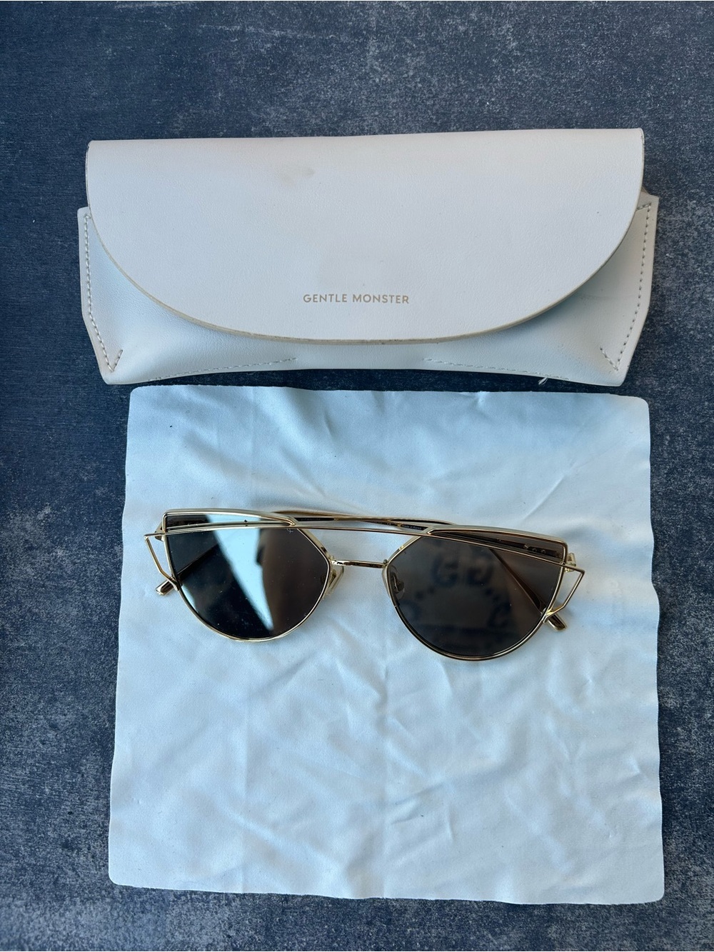 GENTLE MONSTER Gold Frame Sunglasses with Dark Lenses